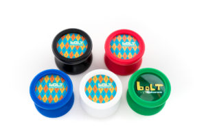 5 yo-yos on a white surface. The yo-yos are Bolt yo-yos in each colorway. Black, red, blud, white, and green.