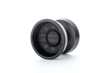 A superblack Populist Yo-Yo, photographed on an endless white background. The yo-yo has black engraving on it with stars and the word "Populist" written on it. It has steel rings.