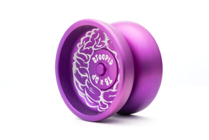 A photo of the Stoopid yo-yo. This is a purple yo-yo with a subtle fade (from light to dark) and white artwork lazer etched on the side. The yo-yo is slim and fits nicely in the pocket.