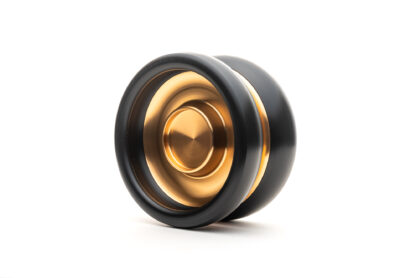 A slimline responsive yo-yo with metal hubs and plastic rims. The yo-yo is slim and has tall inner walls. It has fingerspin cups on the sides. This PLTPS is black plastic with gold aluminum hubs.
