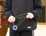 A photo of a person doing the yo-yo trick known as "Double Or Nothing"